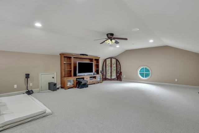 additional living space with ceiling fan, carpet, and vaulted ceiling