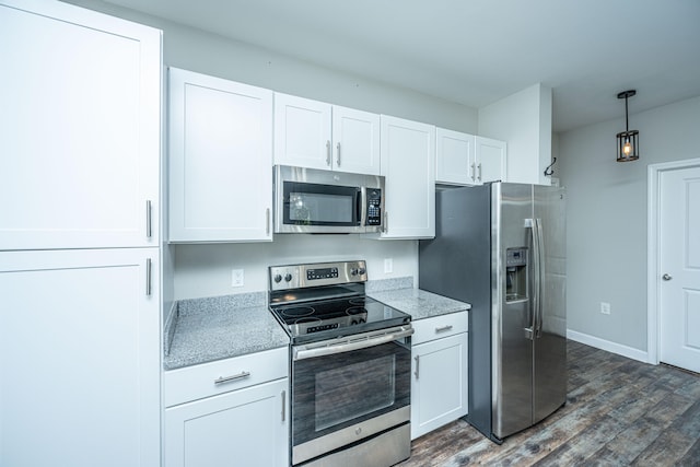 kitchen with white cabinets, stainless steel appliances, and dark wood-type flooring