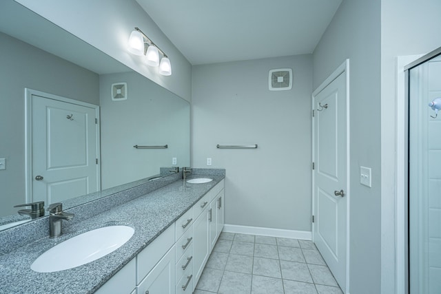 bathroom with vanity and tile patterned floors