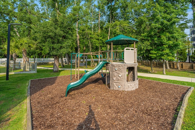 view of playground with a yard