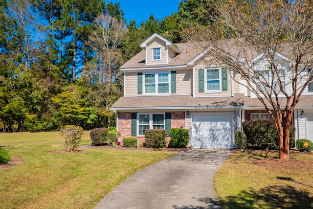 view of front of house with a front lawn and a garage