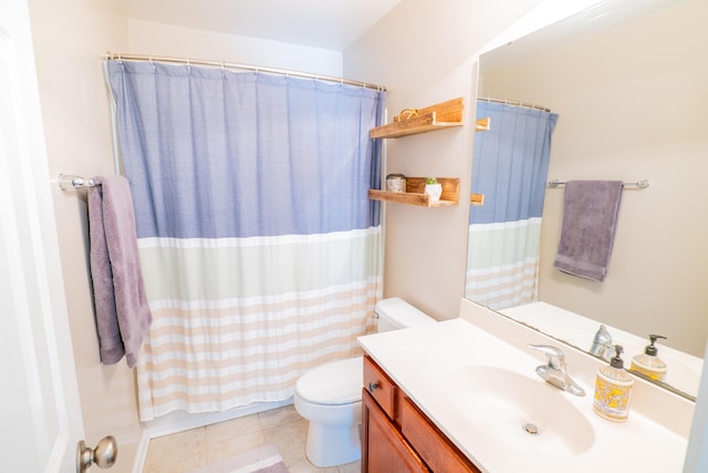 bathroom featuring vanity, toilet, tile patterned flooring, and a shower with shower curtain