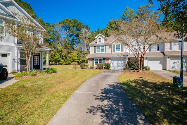 view of property with a garage and a front lawn