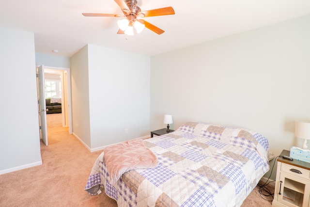 bedroom with light carpet and ceiling fan