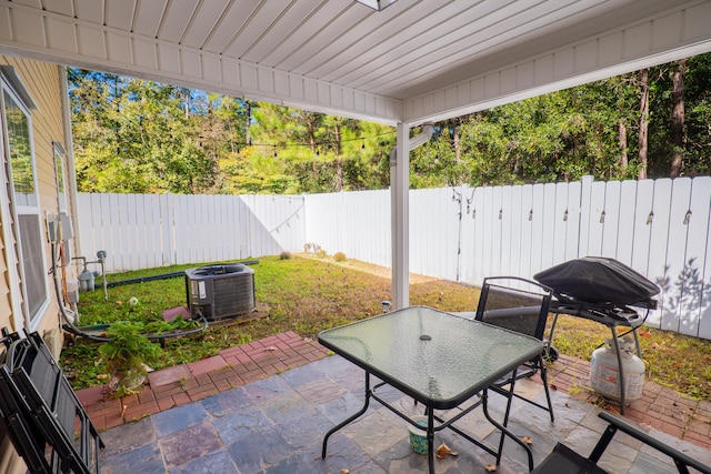 view of patio with cooling unit and grilling area