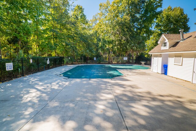 view of pool featuring a patio