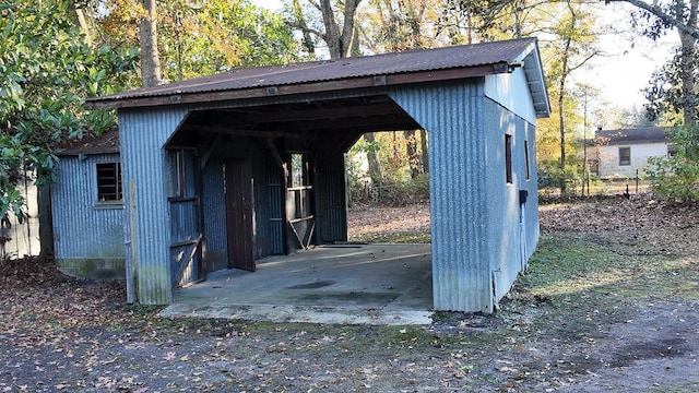 view of vehicle parking with a carport