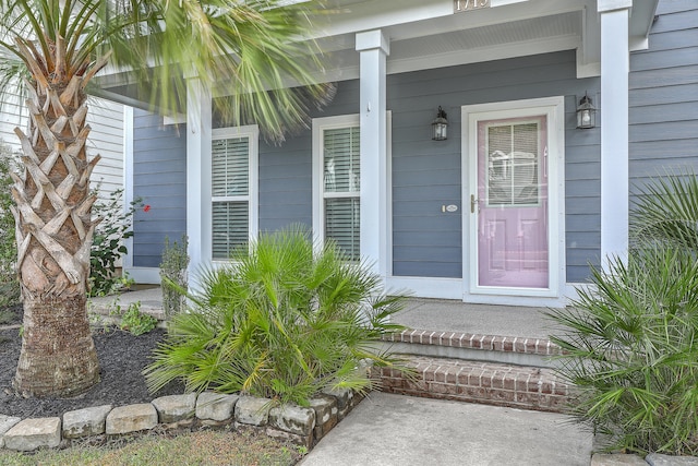 property entrance with covered porch