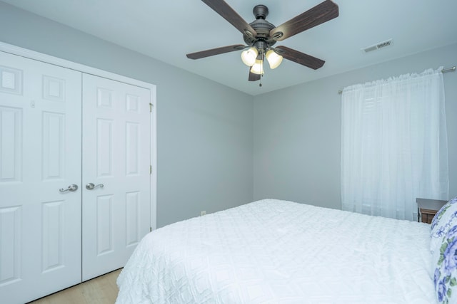 bedroom featuring a closet, ceiling fan, and light hardwood / wood-style floors