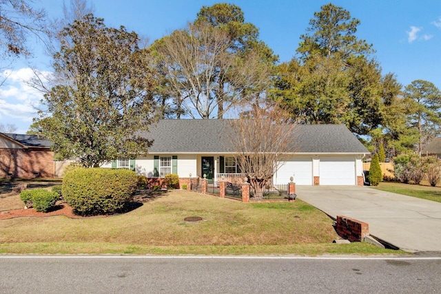 ranch-style house featuring a front lawn, roof with shingles, driveway, and an attached garage