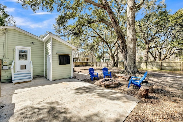 view of patio with fence and entry steps