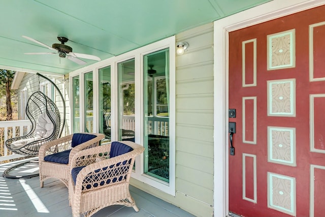 exterior space with a porch and ceiling fan