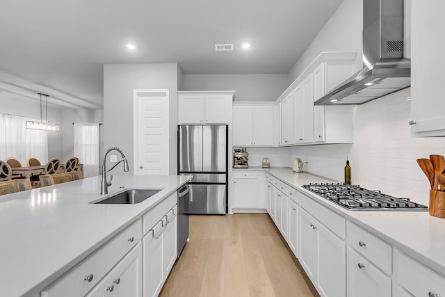 1017 Marsh Royal St, Summerville, SC 29485 - kitchen featuring appliances with stainless steel finishes, wall chimney range hood, a sink, light countertops, and recessed lighting