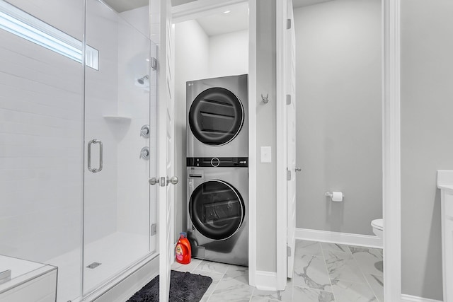 1017 Marsh Royal St, Summerville, SC 29485 - full bath featuring stacked washing machine and dryer, marble finish flooring, a stall shower, toilet, and baseboards