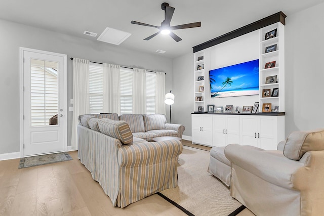 1017 Marsh Royal St, Summerville, SC 29485 - living area with light wood-style floors, ceiling fan, baseboards, and built in shelves