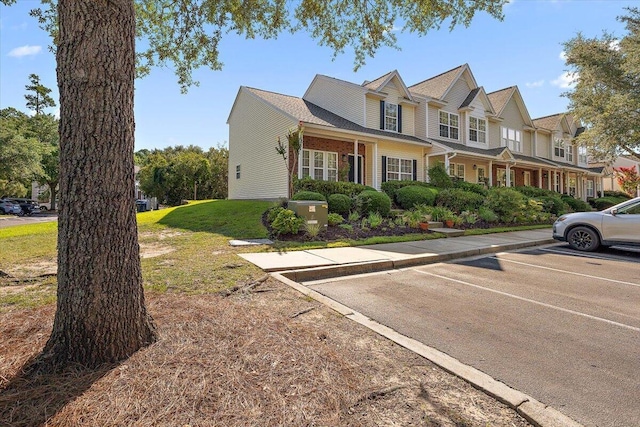 312 Kelsey Blvd, Wando, SC 29492 - view of property with uncovered parking and a front yard