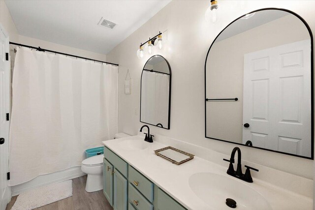 312 Kelsey Blvd, Wando, SC 29492 - bathroom with double vanity, wood finished floors, and curtained shower