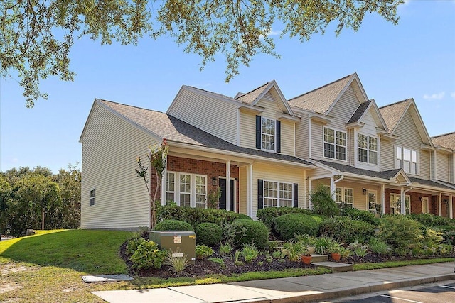 312 Kelsey Blvd, Wando, SC 29492 - view of front facade with a front lawn and brick siding