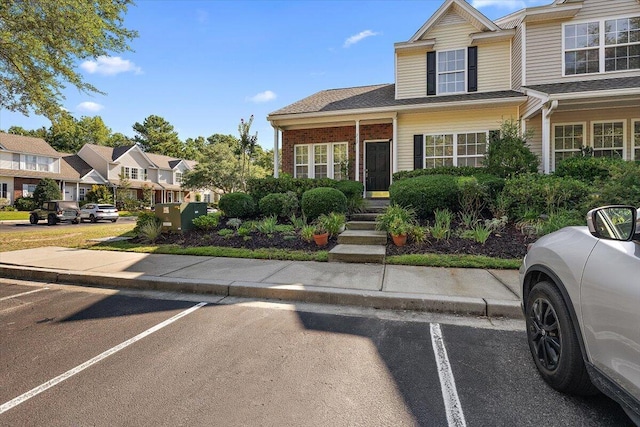 312 Kelsey Blvd, Wando, SC 29492 - multi unit property with uncovered parking, a residential view, and brick siding