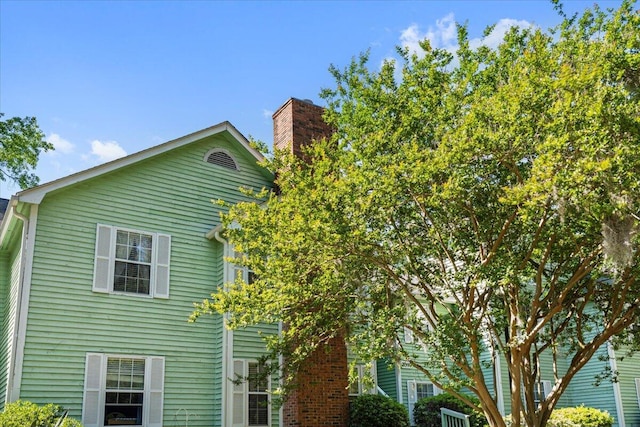 view of side of property featuring a chimney