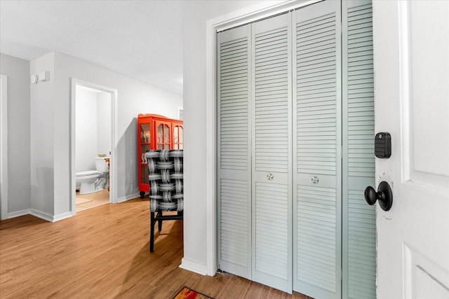 interior space with light wood-style flooring and baseboards