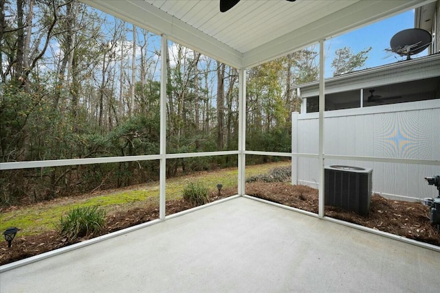 unfurnished sunroom featuring ceiling fan