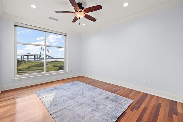 unfurnished room featuring crown molding, ceiling fan, and hardwood / wood-style flooring