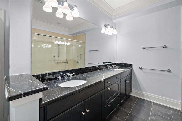 bathroom with vanity, a shower with door, and ornamental molding