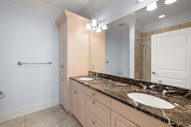 bathroom with crown molding, tile patterned flooring, vanity, and toilet