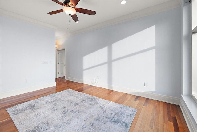 unfurnished room featuring hardwood / wood-style flooring, ceiling fan, and ornamental molding