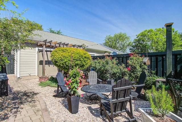 view of patio / terrace with a pergola and fence