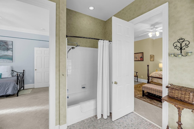 ensuite bathroom featuring shower / tub combo, baseboards, a ceiling fan, ensuite bathroom, and crown molding