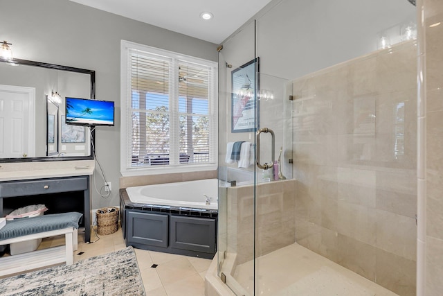 full bath featuring a garden tub, a shower stall, and tile patterned floors