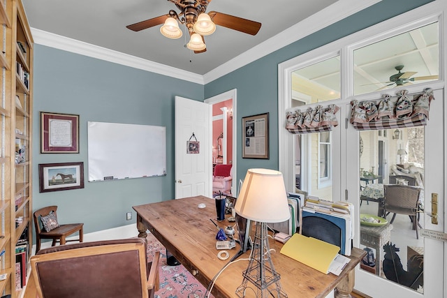 office area featuring a ceiling fan, crown molding, and baseboards