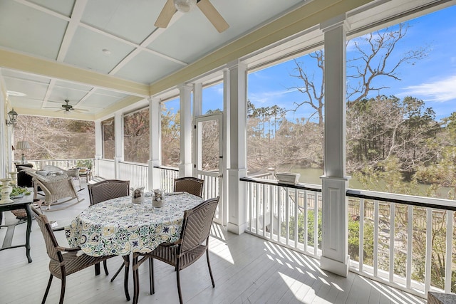 sunroom with ceiling fan and coffered ceiling