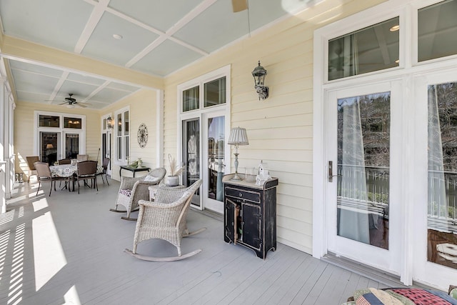 deck with ceiling fan and outdoor dining area