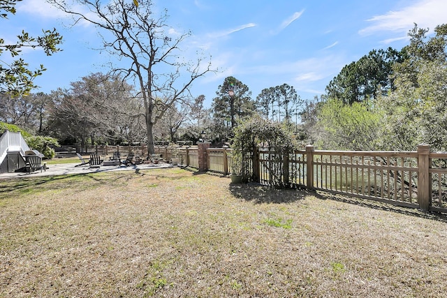 view of yard featuring a patio area and fence