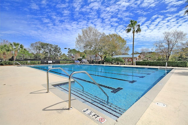 community pool with a patio area