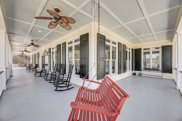 view of patio with ceiling fan and a porch