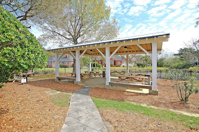 surrounding community with fence and a gazebo