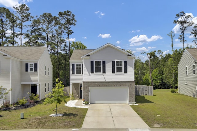 traditional home featuring an attached garage, a front yard, brick siding, and concrete driveway