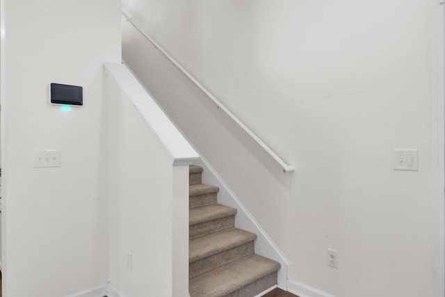 stairs featuring baseboards