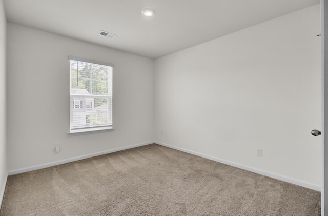 carpeted spare room with baseboards, recessed lighting, and visible vents