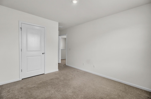 unfurnished bedroom with carpet floors, recessed lighting, and baseboards
