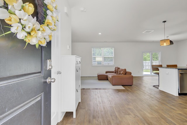 foyer entrance featuring recessed lighting, baseboards, visible vents, and wood finished floors