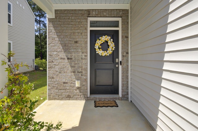 property entrance with stone siding