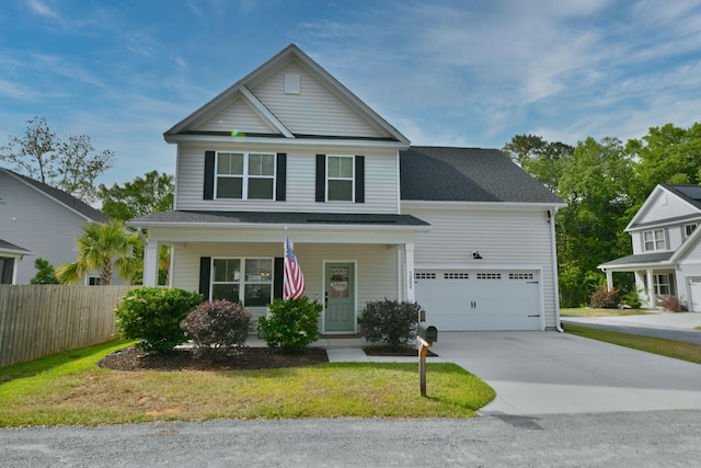 view of front of house featuring covered porch, an attached garage, fence, a front lawn, and driveway
