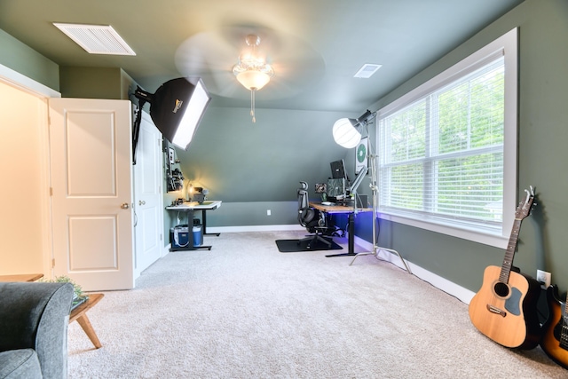 office area featuring baseboards, ceiling fan, visible vents, and carpet