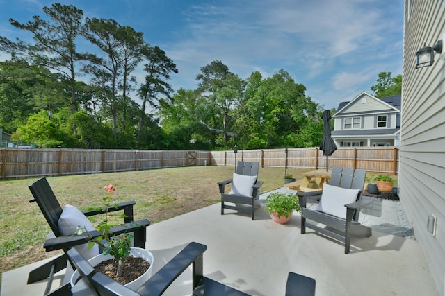 view of patio featuring a fenced backyard and an outdoor living space