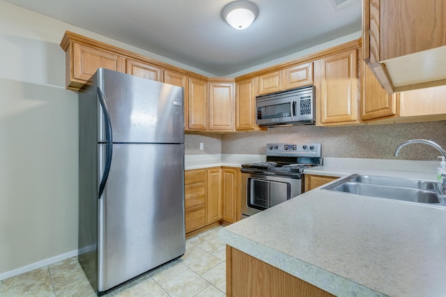 7945 Parklane Ct Unit C, North Charleston, SC 29418 - kitchen with stainless steel appliances, a sink, light countertops, and light tile patterned flooring